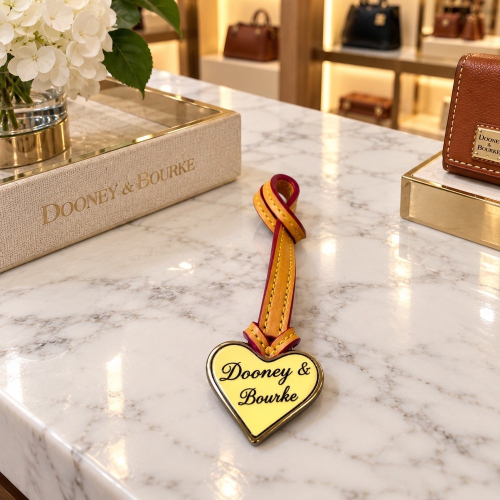 Dooney & Bourke Heart Charm Logo Vachetta Leather Strap Gold Tone Fob